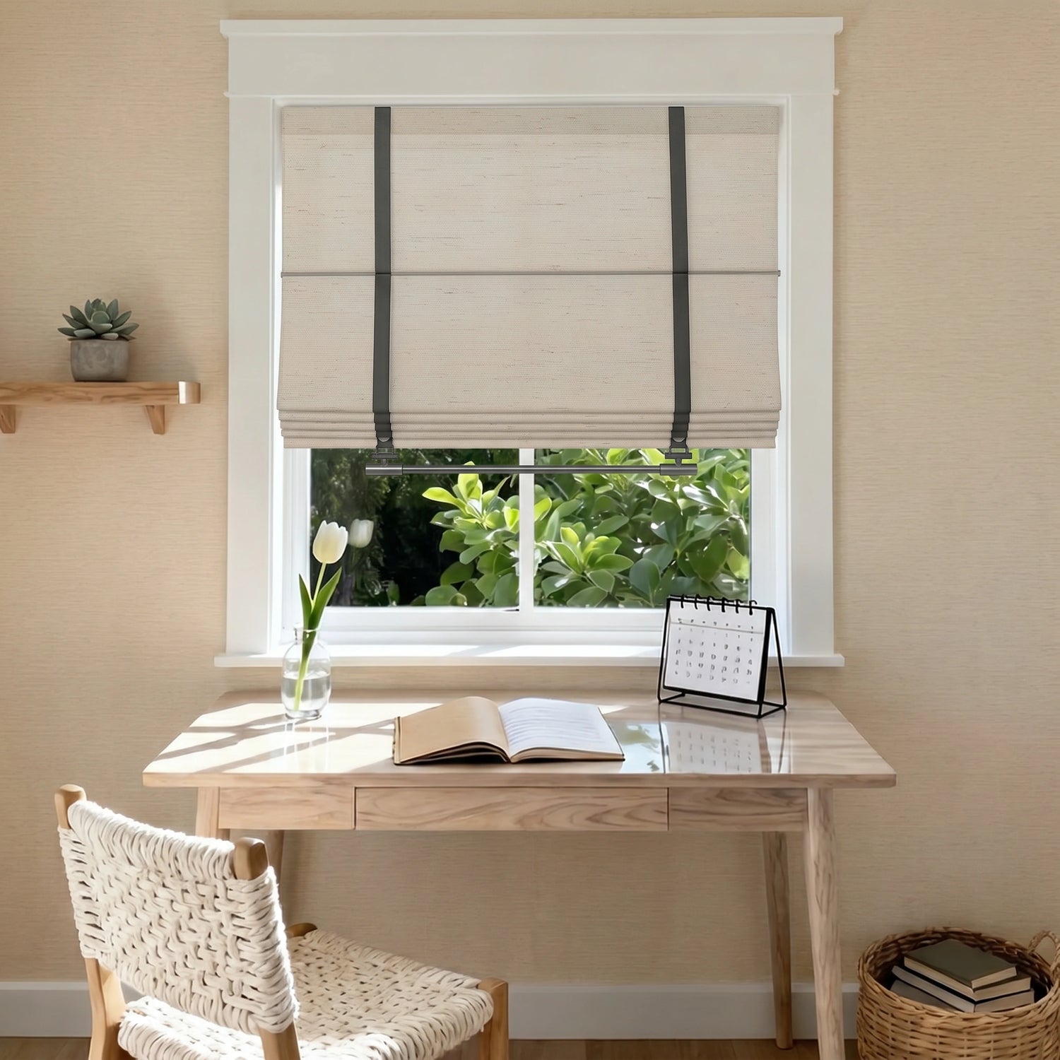 Custom linen Roman shades for windows, styled above a wooden desk with beige fabric, dark straps, privacy coverage, and natural daylight.