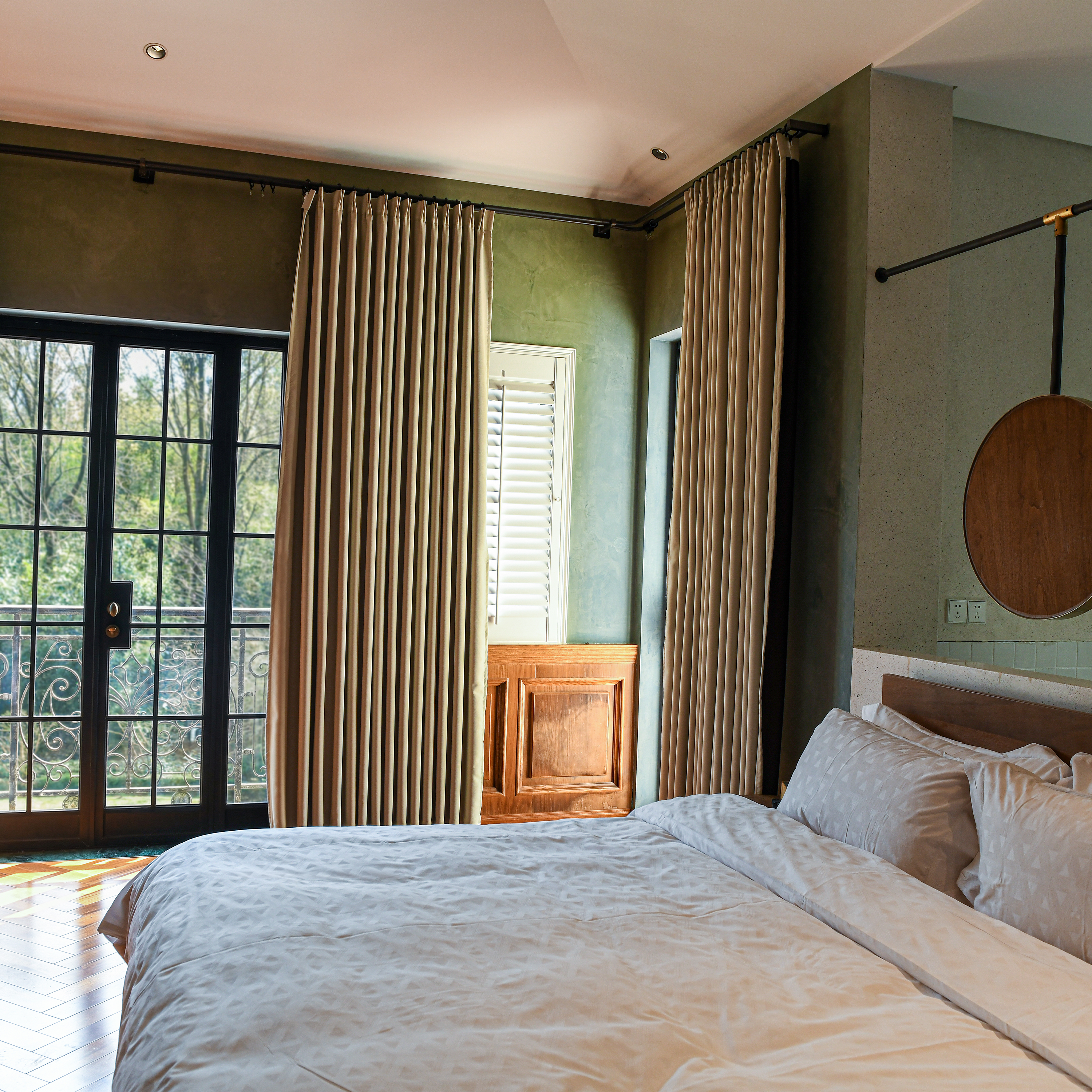 DWCN Official heavyweight black cotton blackout curtains hanging, offering light-blocking and privacy for bedroom or living room windows.