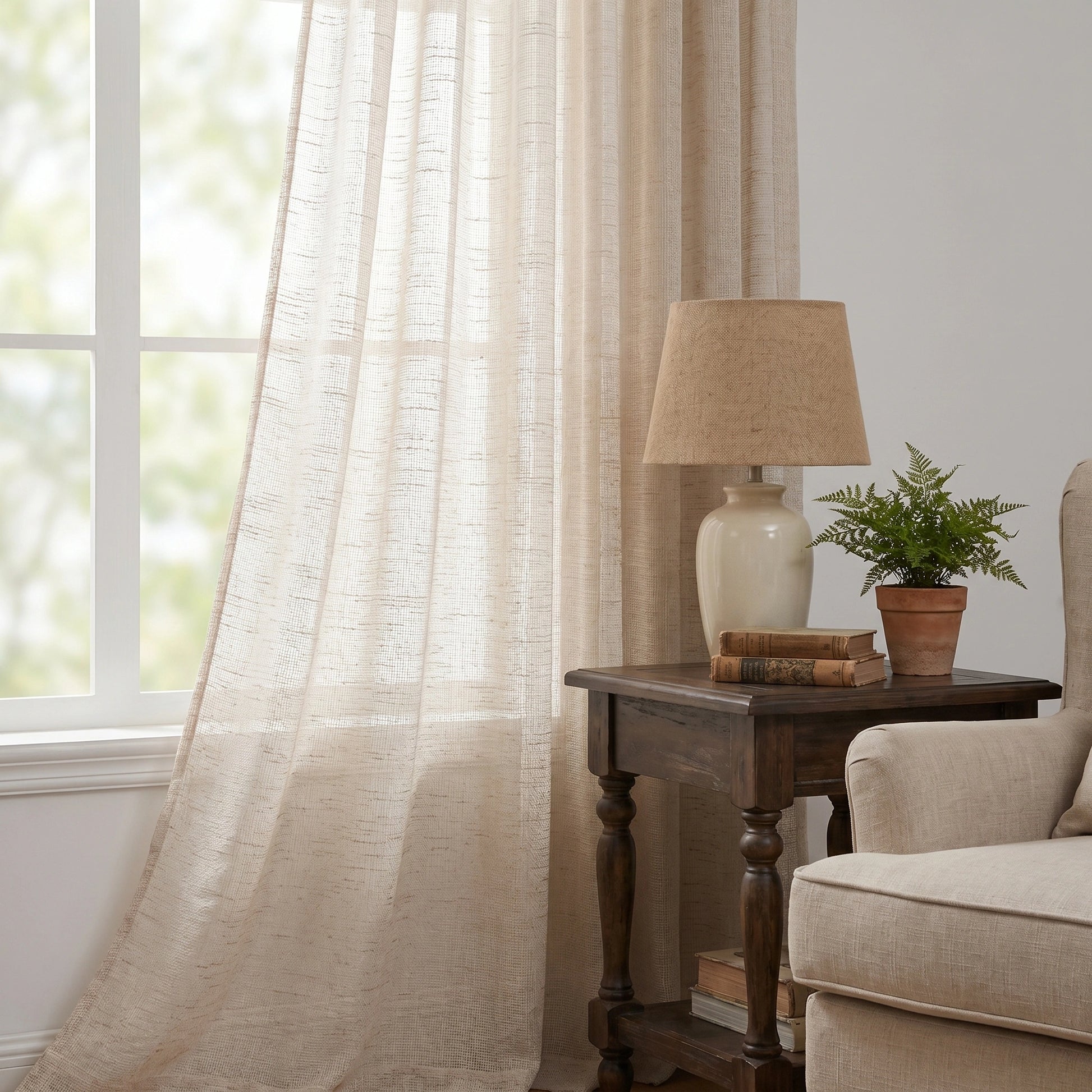 DWCN Official Phoebe Soft Oat Linen Sheer Curtain hanging in a window, showcasing its lightweight, airy fabric and neutral oat color.